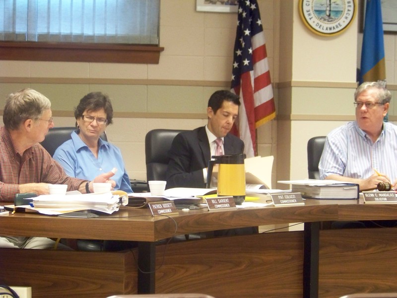 The Rehoboth Beach commissioners gave Commissioner Bill Sargent 30 days to explore the concept of a detached police station as part of the city's plans for a new City Hall complex. Debating the issue at the June 10 commissioners' meeting are (l-r) Sargent, Commissioner Pat Coluzzi, City Solicitor Glenn Mandalas and Mayor Sam Cooper. BY RYAN MAVITY